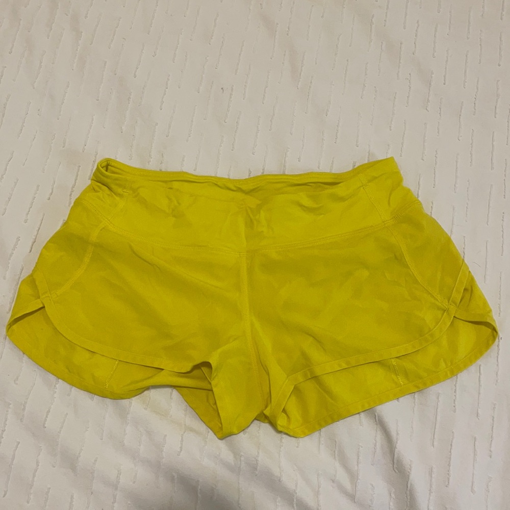 Lululemon yellow midrise shorts size 4